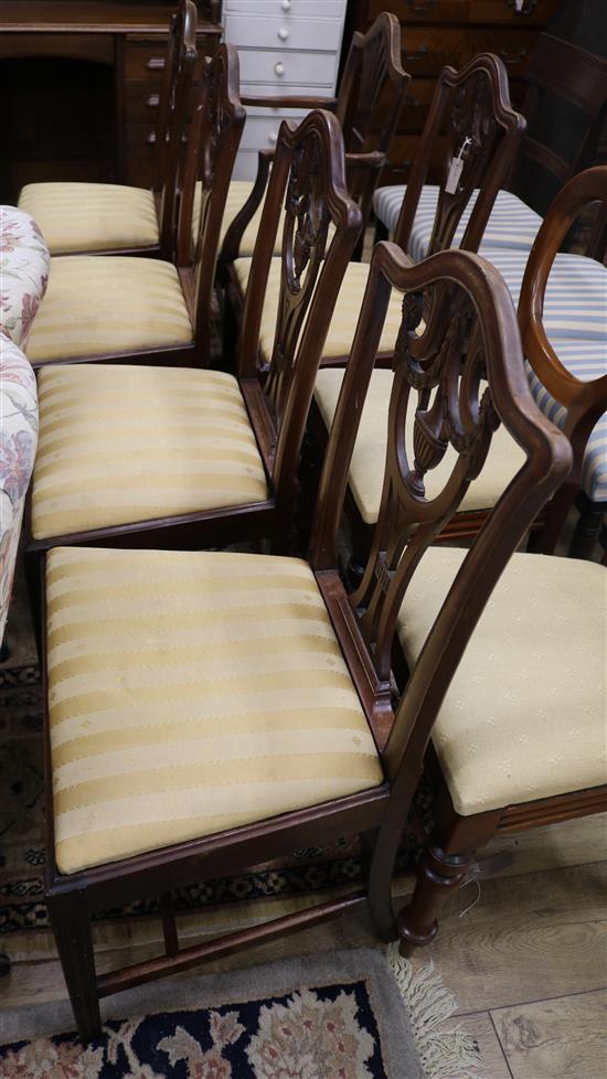 A set of five George III mahogany dining chairs and a similar carver